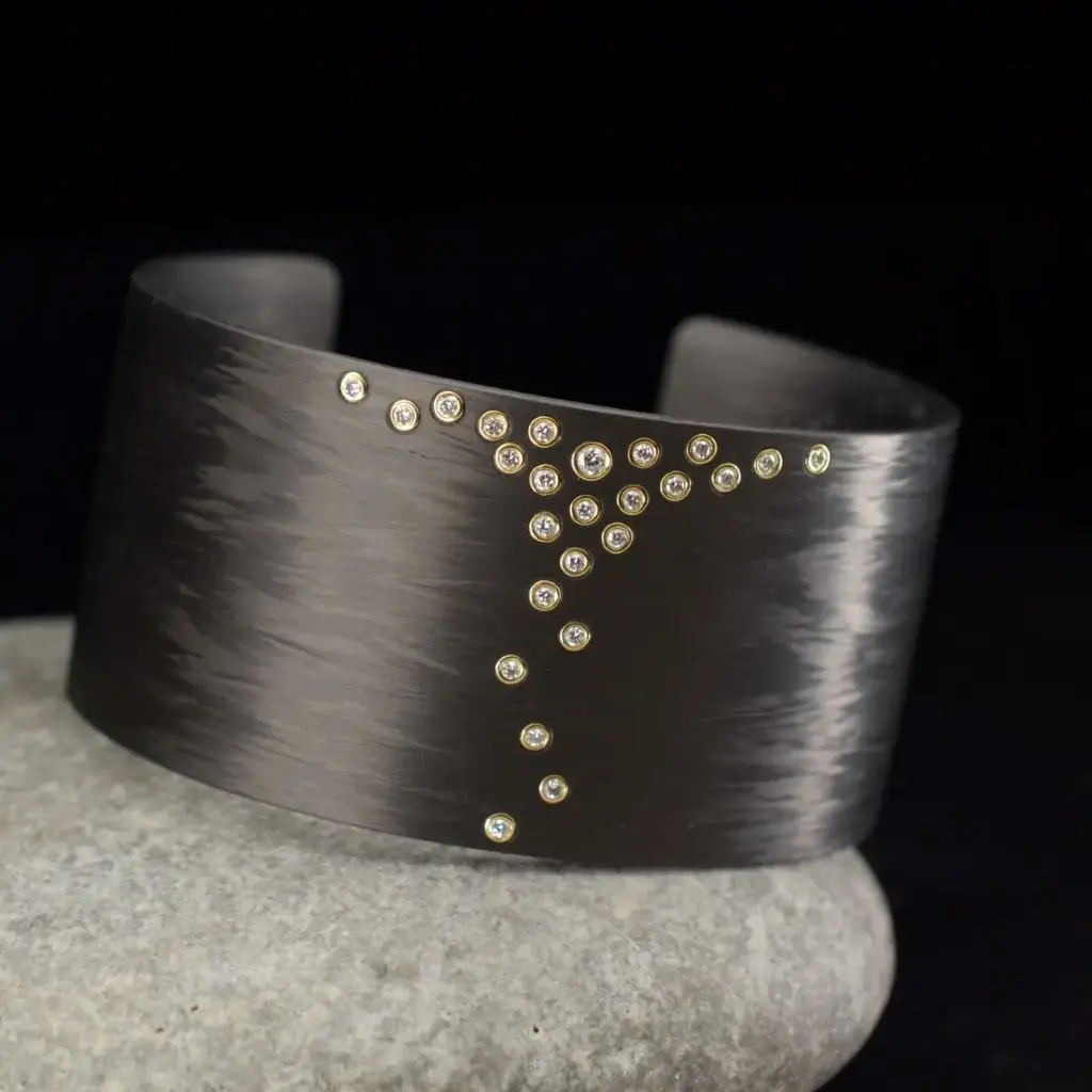 Bracelet carbone or et diamants
